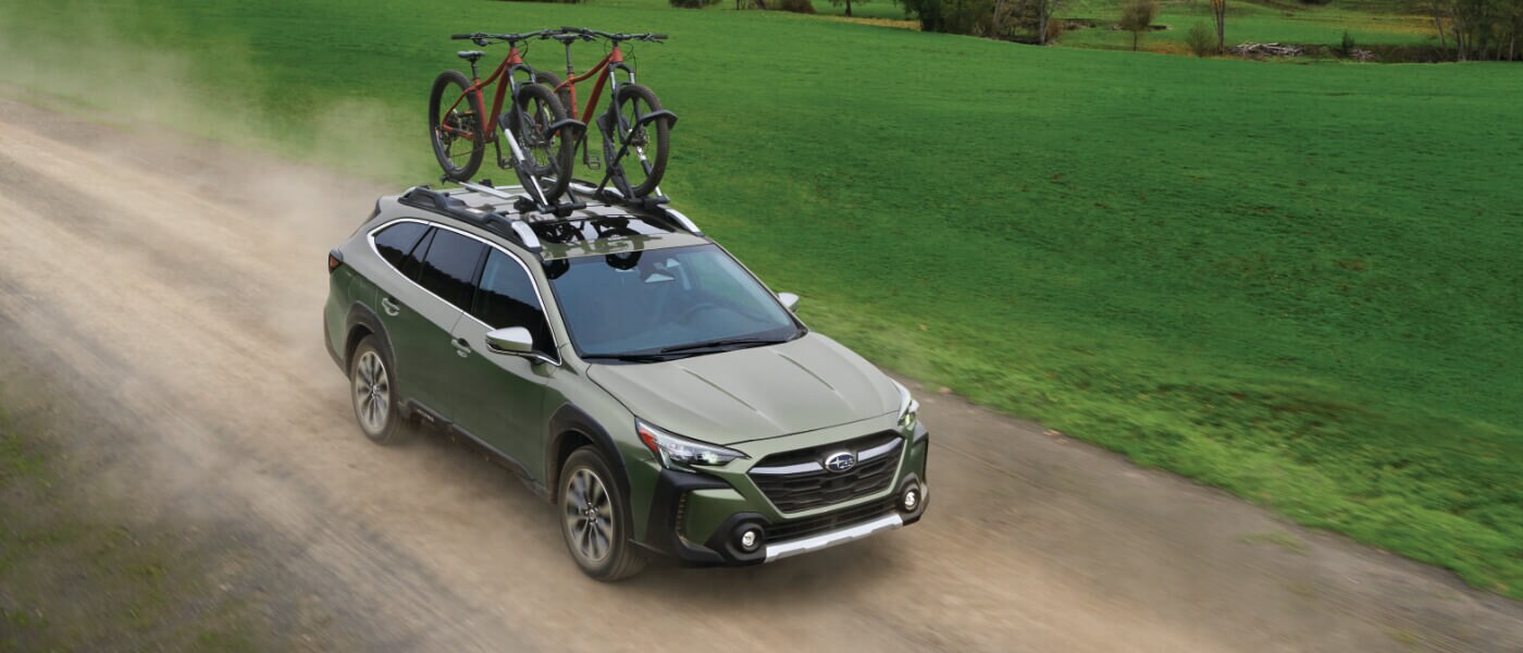 2025 Subaru Outback Exterior On Dirt Road With Bikes