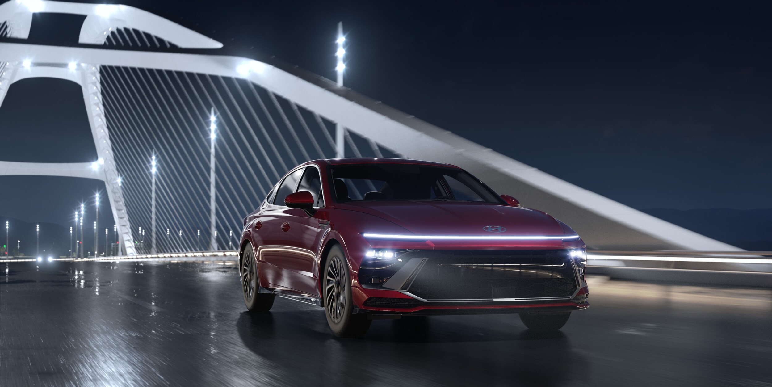 2024_Sonata_HEV_SEL_FWD_UltimateRed_Black_360_Landscape_CityBridge.001.jpg The 2025 Hyundai Sonata SEL with a red exterior driving over a bridge at night