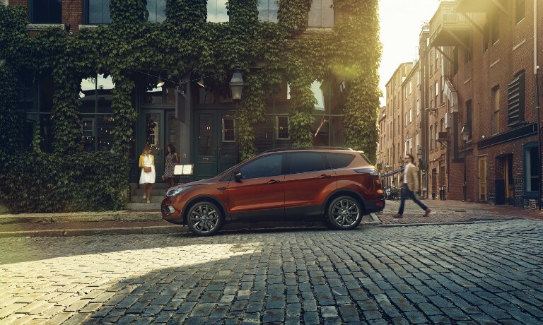 A red 2017 Ford Escape in city