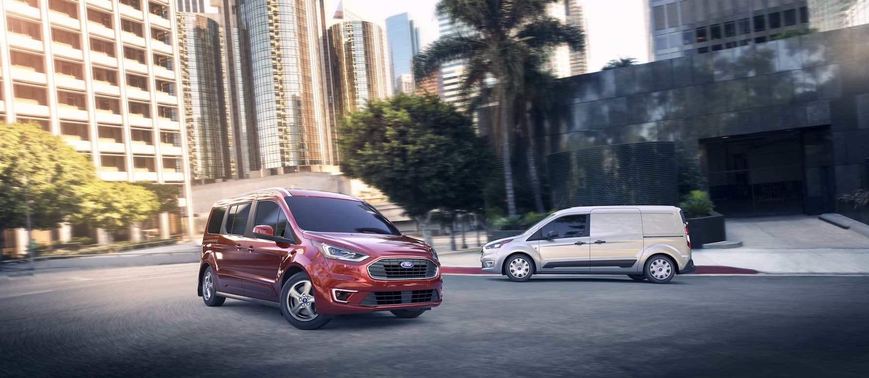 A 2020 Ford Transit and Ford Transit Connect parked near each other