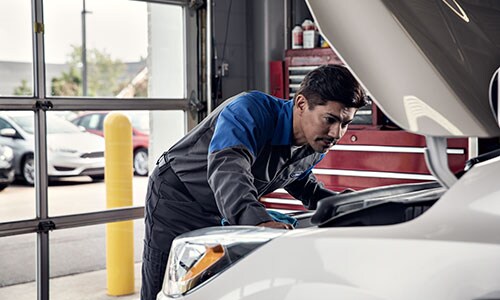 Great Lakes Ford Service Center Ford service technician checking for vehicle