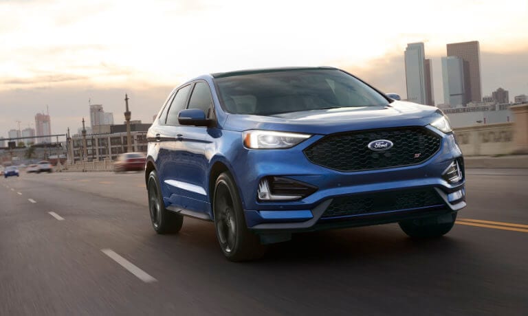 Blue 2019 Ford Edge on road