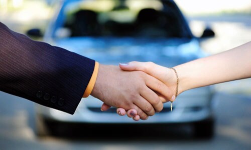Great Lakes Ford Financing Man shaking hands with woman for car deal