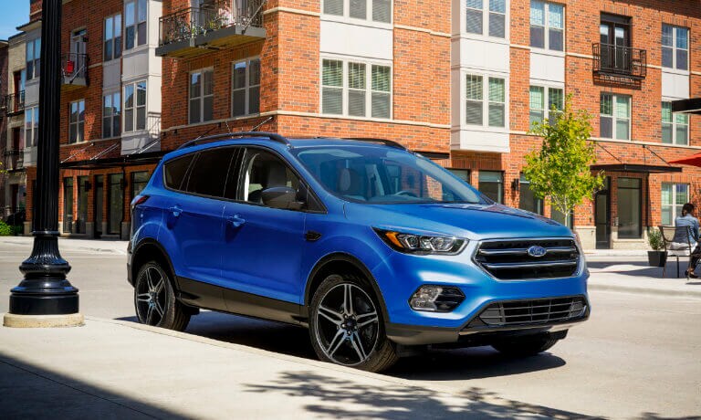 A blue 2019 Ford Escape in city