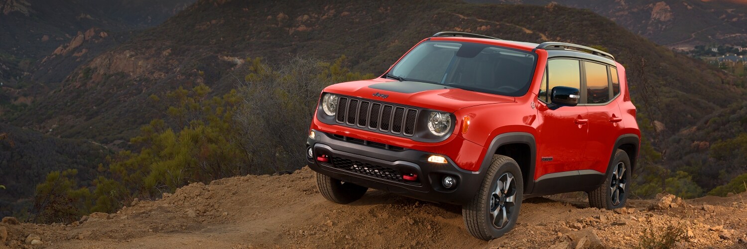 2023 Jeep Renegade red jeep Renegade parked outside on a mountain