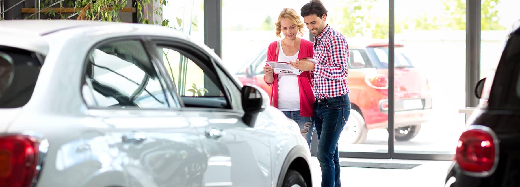 a-happy-couple-buying-their-first-vehicle.jpg