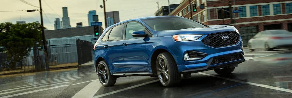 2019 Blue Ford Edge Driving in Rain