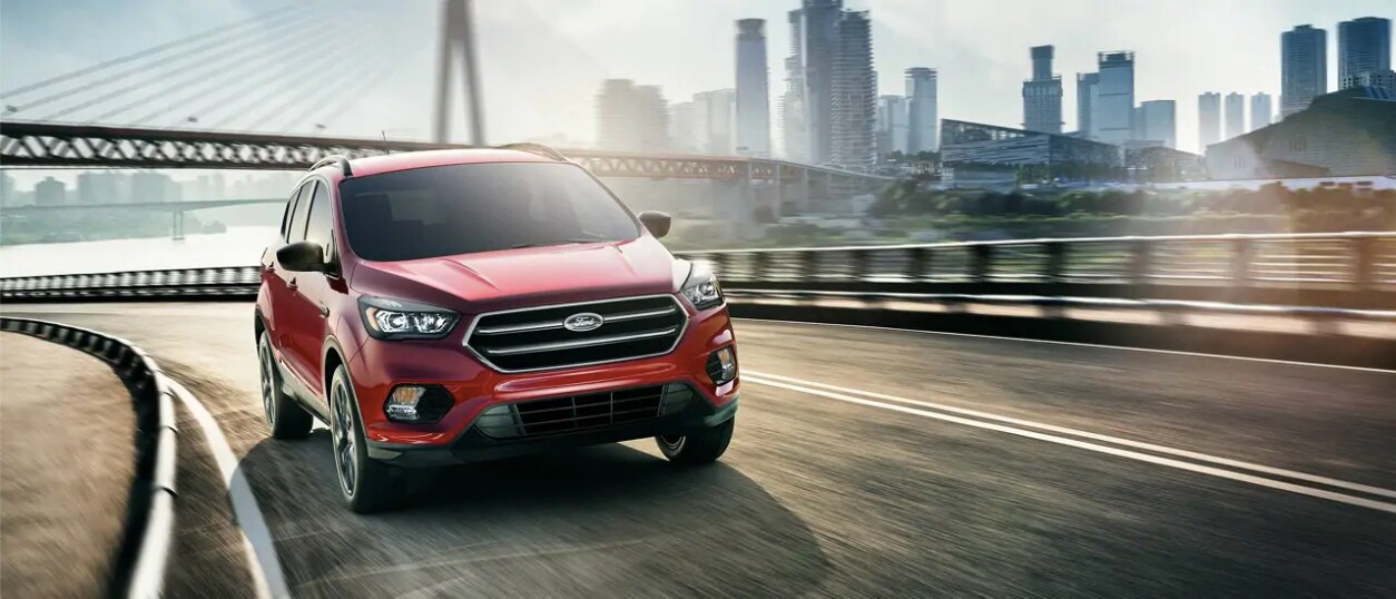 2019 Red Ford Escape Driving Under a Bridge