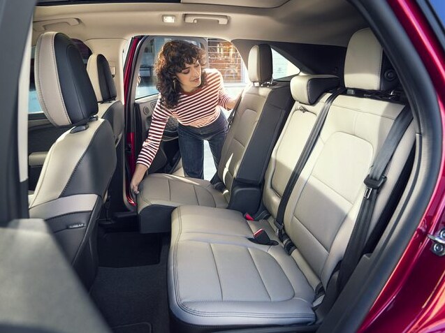 2022 Ford Escape Back Seats.PNG red Ford Escape back seat, driver adjusting the position