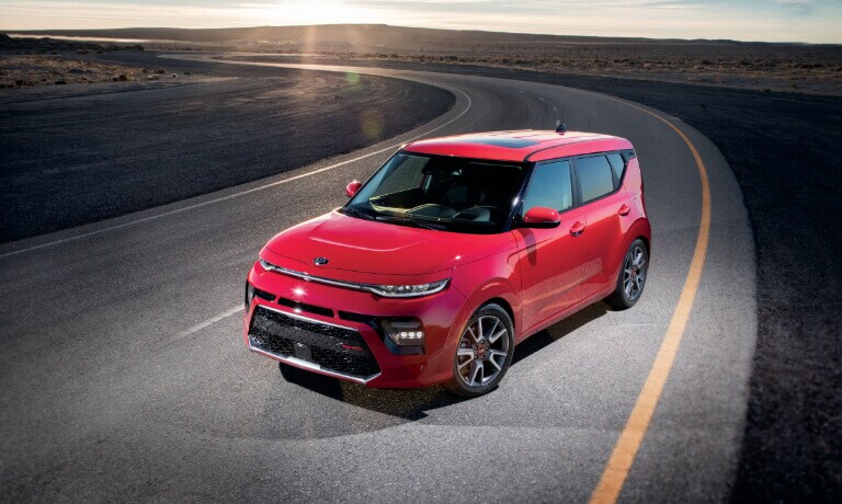 2020 Kia Soul in red parked on track in the desert