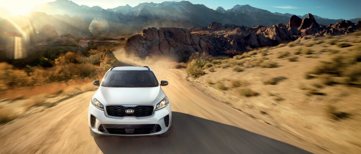 2020 Kia Sorento in white driving on desert road front view