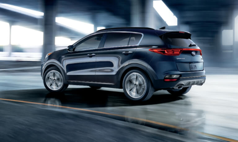 2020 Kia Sportage in black driving under a bridge