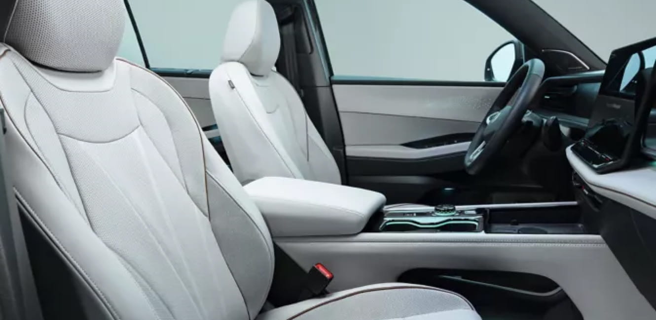Close-up of the 2027 Volkswagen Atlas front seats featuring light-colored leather upholstery and a modern cabin design.