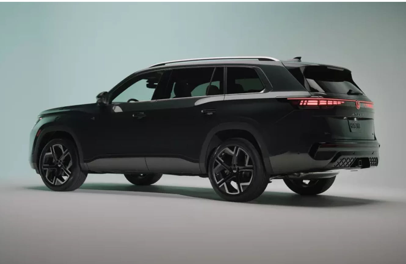 2027 Volkswagen Atlas shown from a rear three-quarter view on a light green studio background.