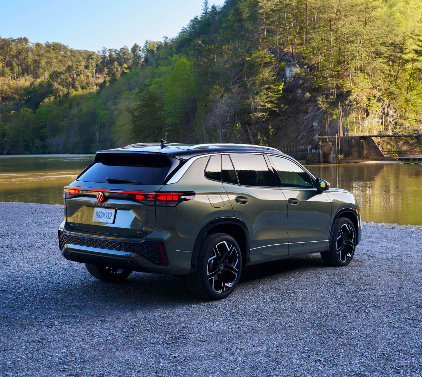 Three quarter rear view of a Volkswagen Tiguan in front of a lake