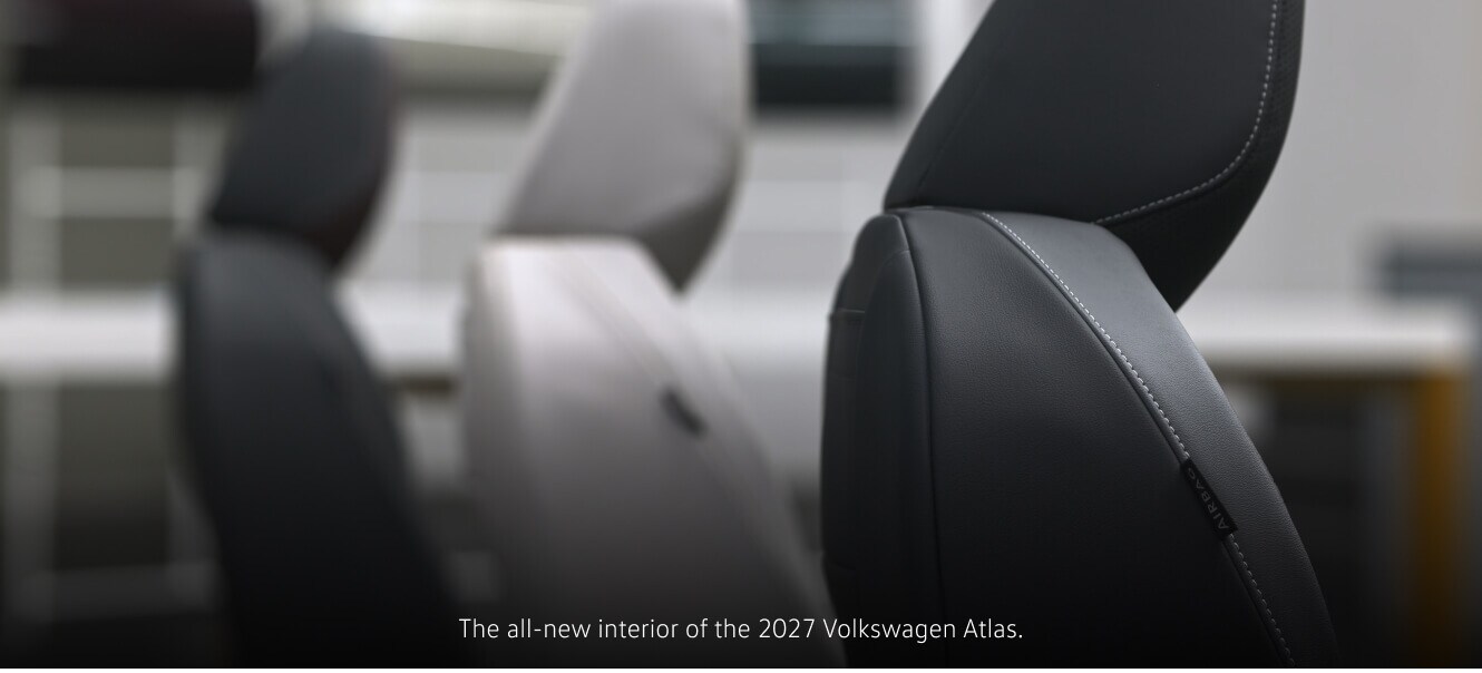 Profile view of a 2027 Volkswagen Atlas seats featuring contrast stitching in a studio setting.