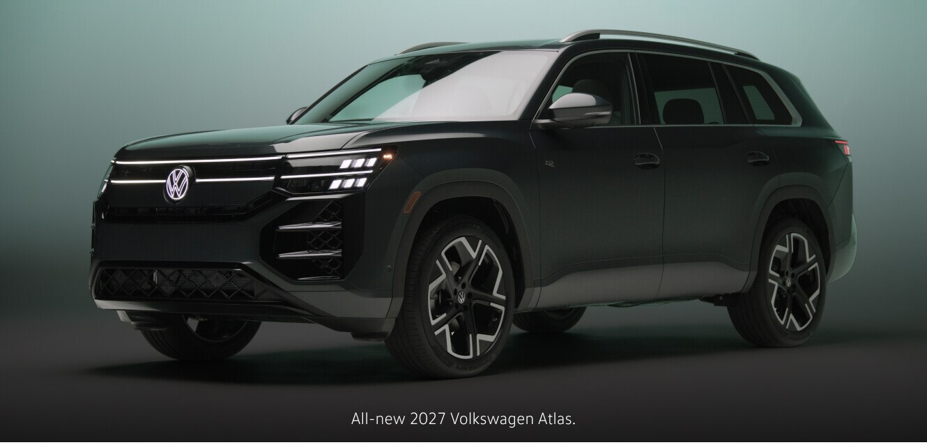 Three-quarter front view of a 2027 Volkswagen Atlas SEL R-Line parked against a studio backdrop.