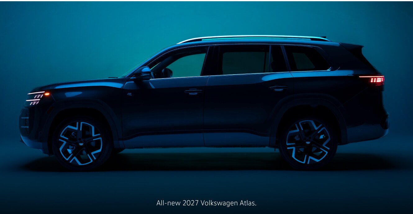 Side view of a 2027 Volkswagen Atlas showcasing its geometric wheels against a neon background.