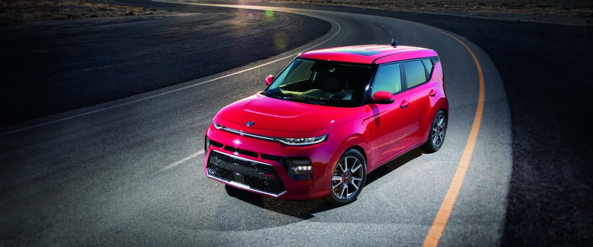 2020 Kia Soul A red 2020 Kia Soul parked under a street light