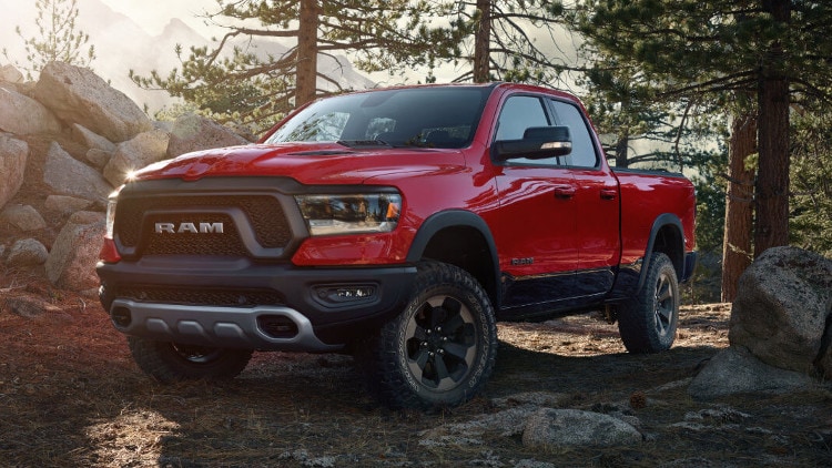 Ram 1500 A red Ram 1500 Parked in a Forest