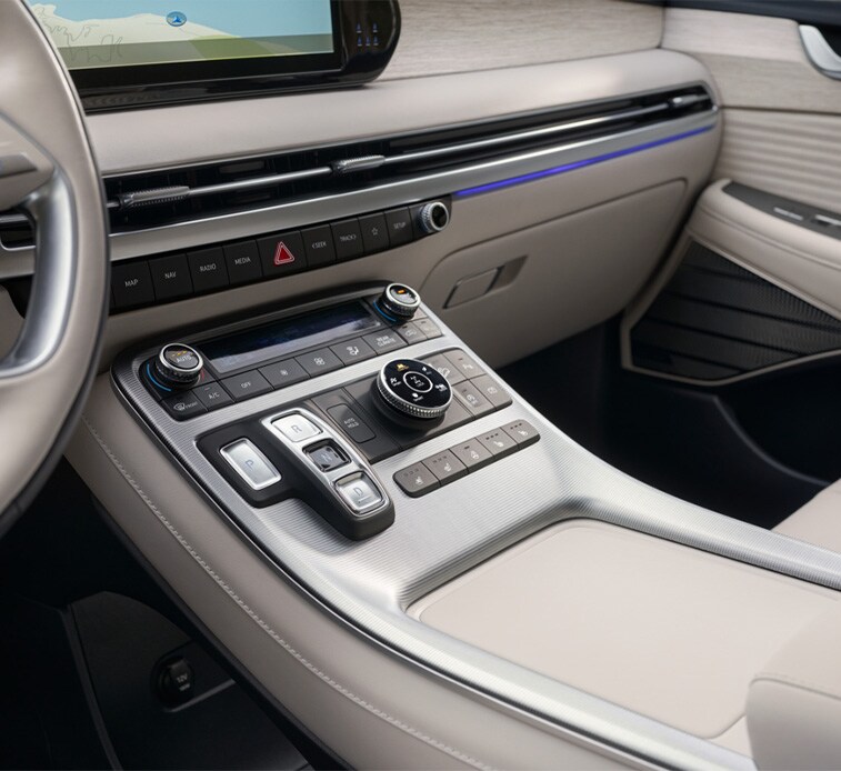 All-New 2023 Hyundai Palisade at Haddad Hyundai | Close up of center console with light grey color interior