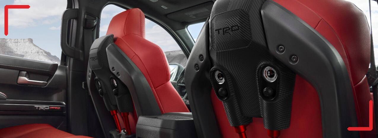 2024 Toyota Tacoma at Haddad Toyota in Pittsfield, MA | Close up of TRD trim level read seats