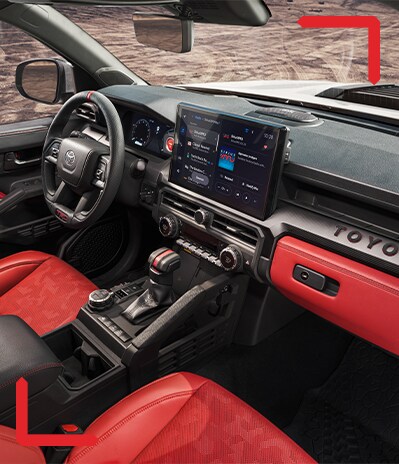 2024 Toyota Tacoma at Haddad Toyota in Pittsfield, MA | Black and red interior of 2024 Toyota Tacoma