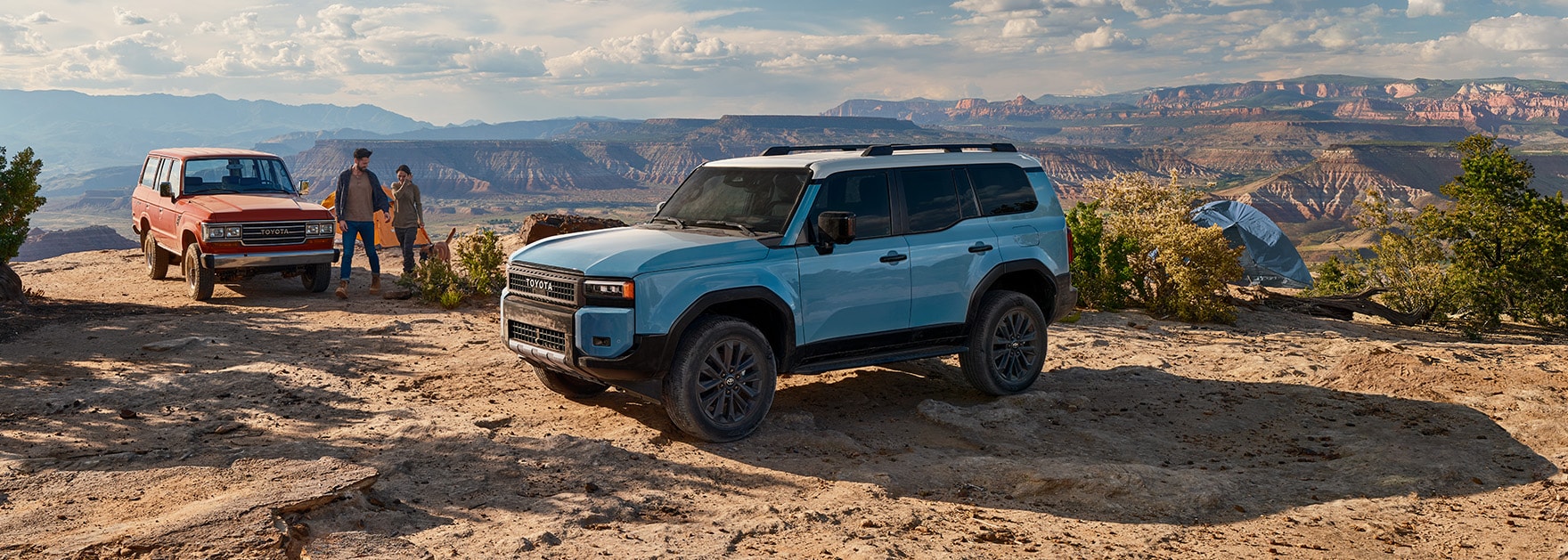 2024 Toyota Land Cruiser at Haddad Toyota in Pittsfield, MA | New 2024 Toyota Landcruiser in the color blue, parked on top of mountain with a view