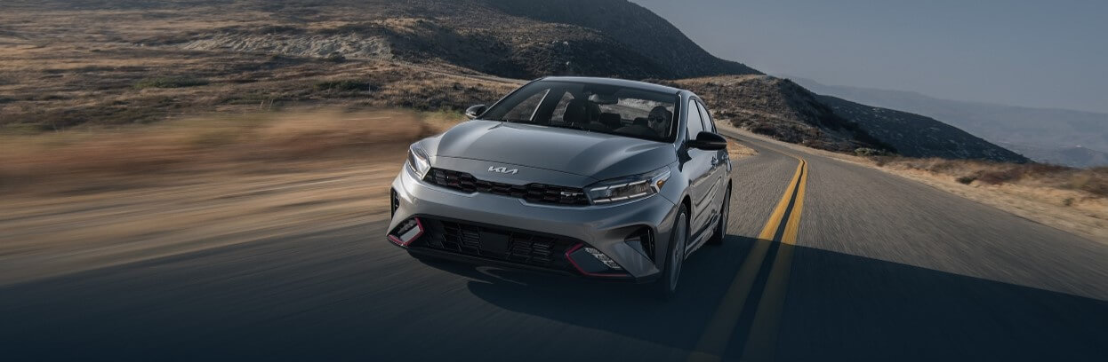 New 2023 Kia Forte Driving Down The Road