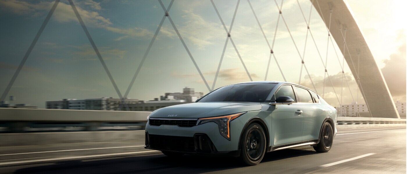 2025 Kia K4 Exterior Driving On Bridge