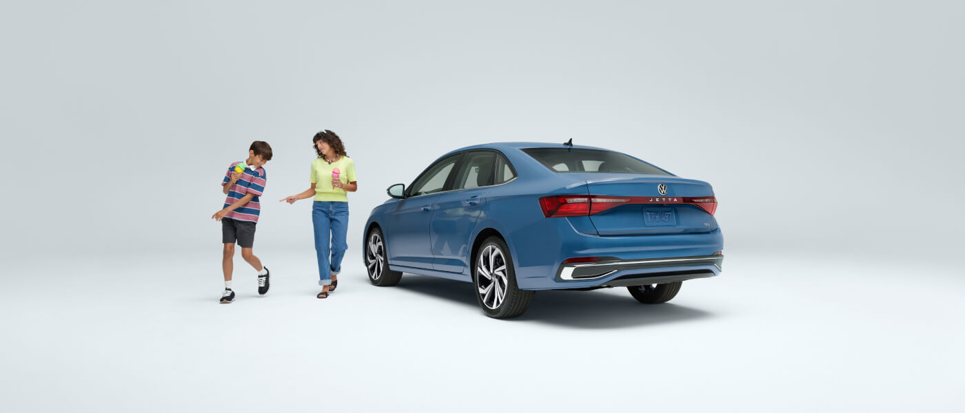 2025 VW Jetta side view with two people from back