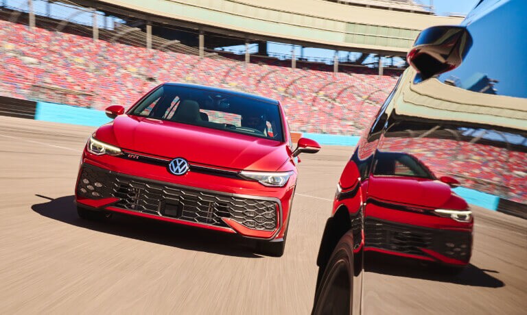 2025 Volkswagen Golf GTI head on behind other car