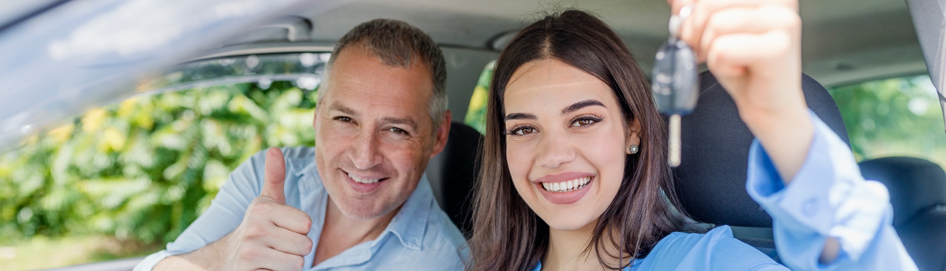 First Time Buyers driving off in their new vehicle