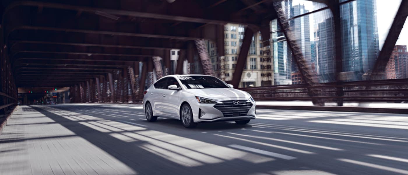 2020 White Hyundai Elantra Driving Over a Bridge