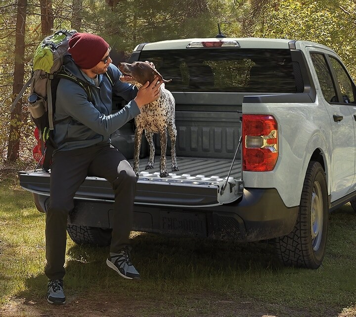Dog and Best Friend Sitting on Tailgate of Ford Maverick