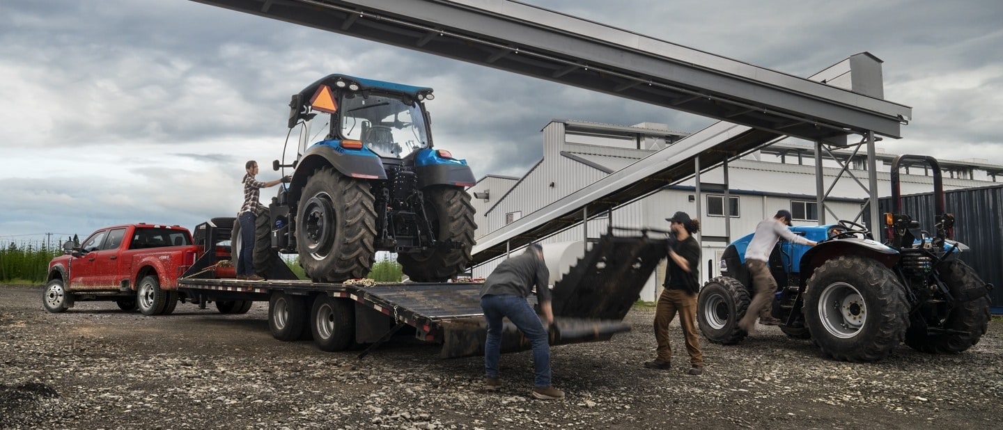 Loading Equipment on Trailer Bed Being Towed by The Ford Super Duty