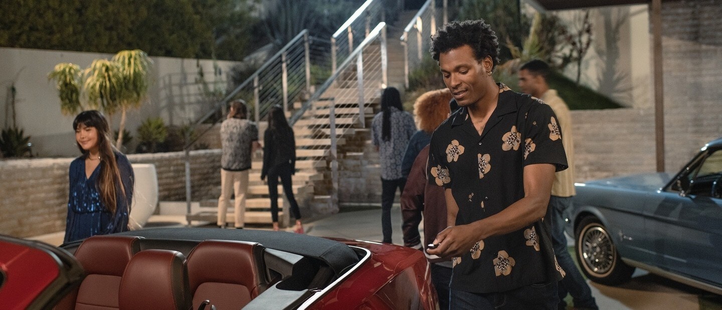 Two People Entering the Ford Mustang