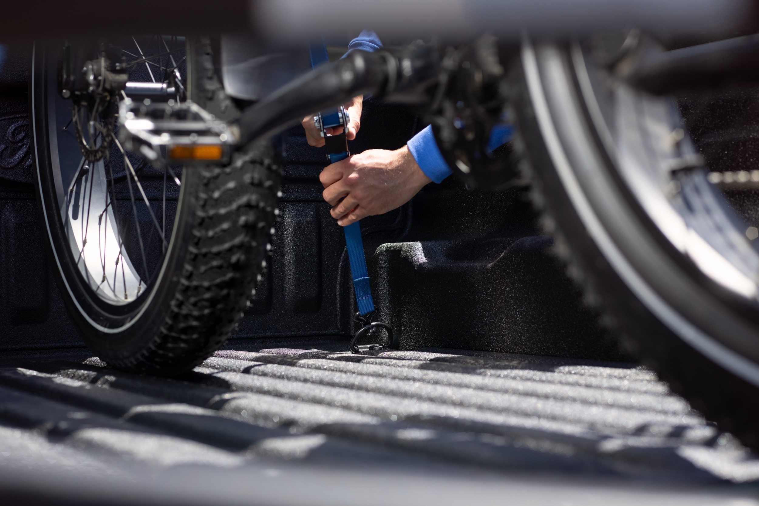 Bicycle being put into Cargo Bed of Ford Maverick