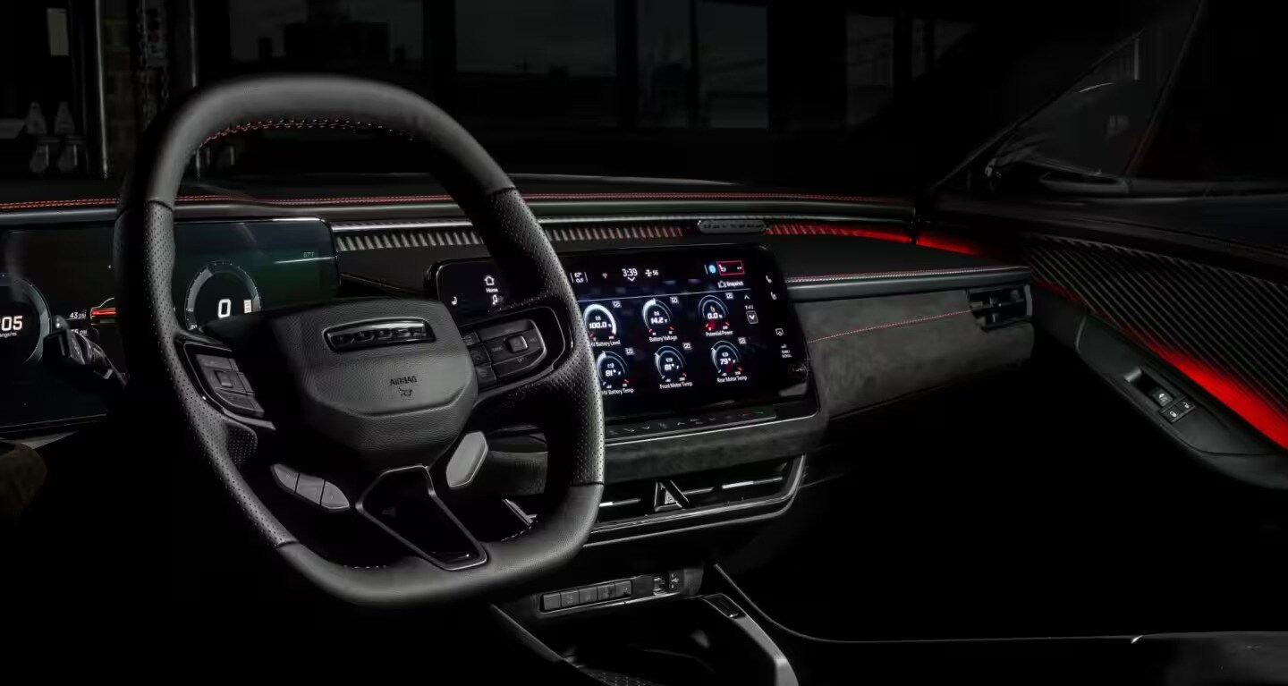 View of the driver's seat and digital cluster inside the 2026 Dodge Charger Daytona.
