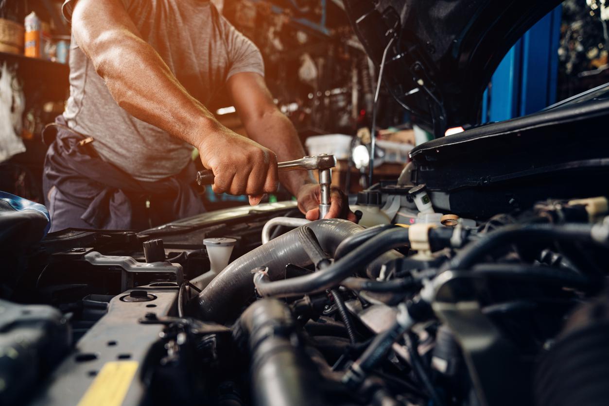A%20Subaru%20certified%20technician%20works%20on%20the%20engine%20compartment%20of%20a%20Subaru..jpg A Subaru certified technician works on the engine compartment of a Subaru.