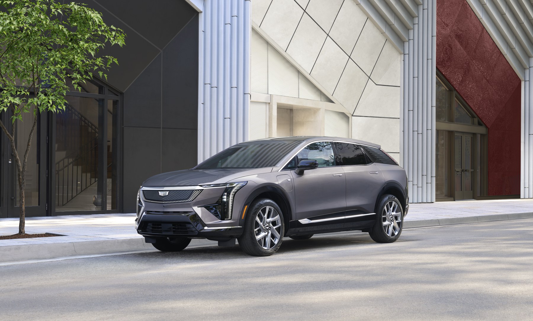 Cadillac OPTIQ compact electric luxury SUV in an urban setting