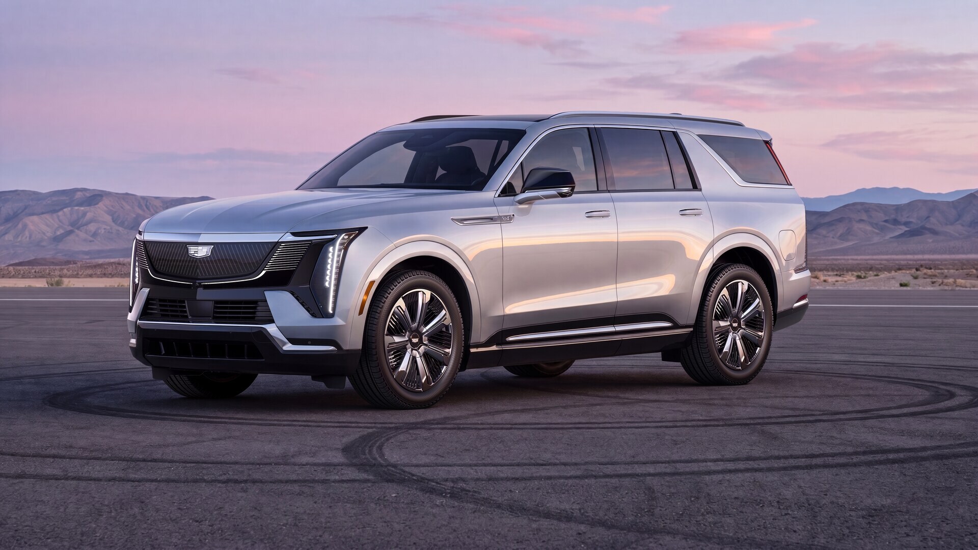 Cadillac ESCALADE IQ all-electric luxury SUV in a wide landscape setting
