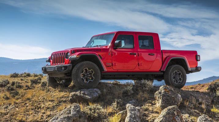 2020 Jeep Gladiator A red 2020 Jeep Gladiator parked on rocks