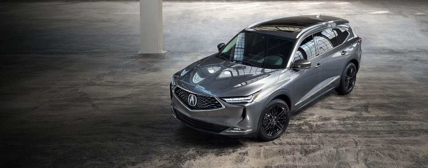 2023%20Acura%20MDX%20-%20Silver.jpg Silver 2023 Acura MDX parked inside