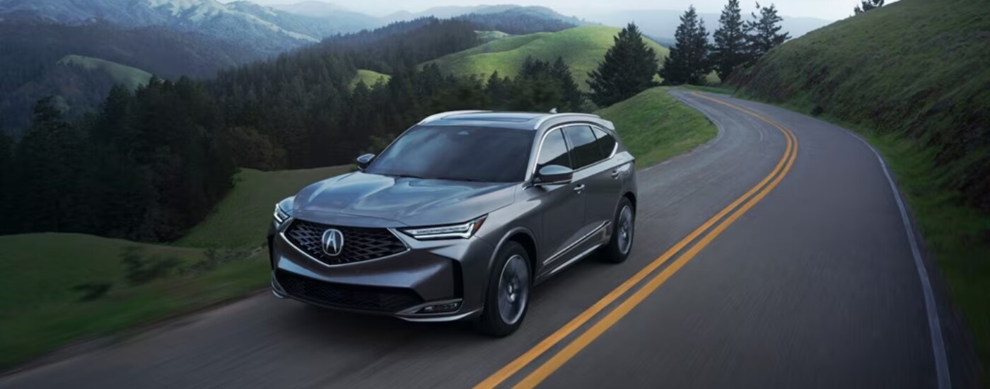 2026%20Acura%20MDX%20-%20foothills.png Silver 2026 Acura MDX driving on a winding road