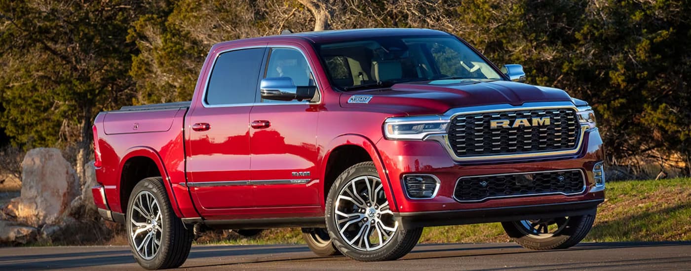 Red 2025 Ram 1500 Tradesman driving.