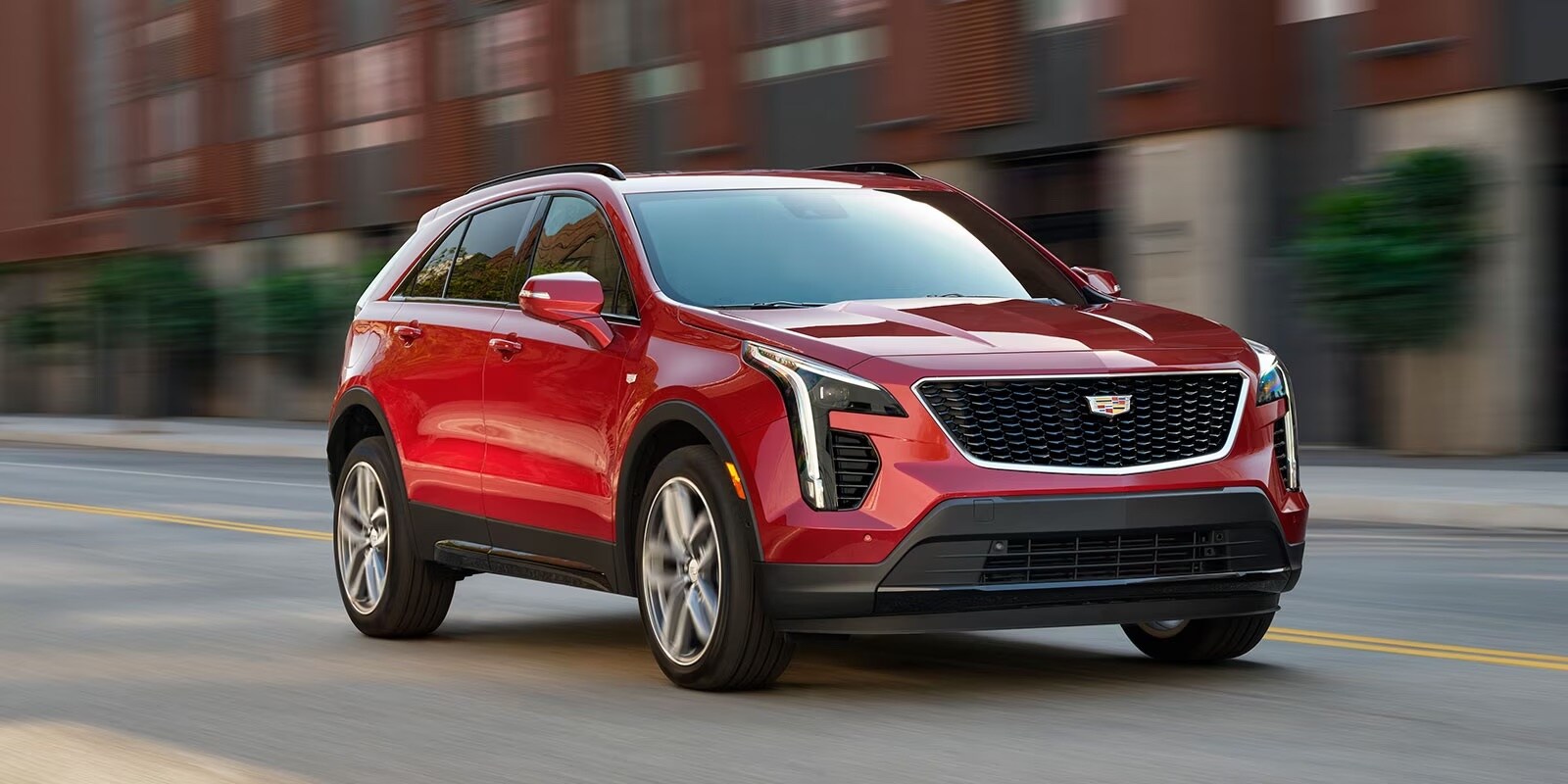 my23-xt4-gallery-modal-exterior-driving.jpeg