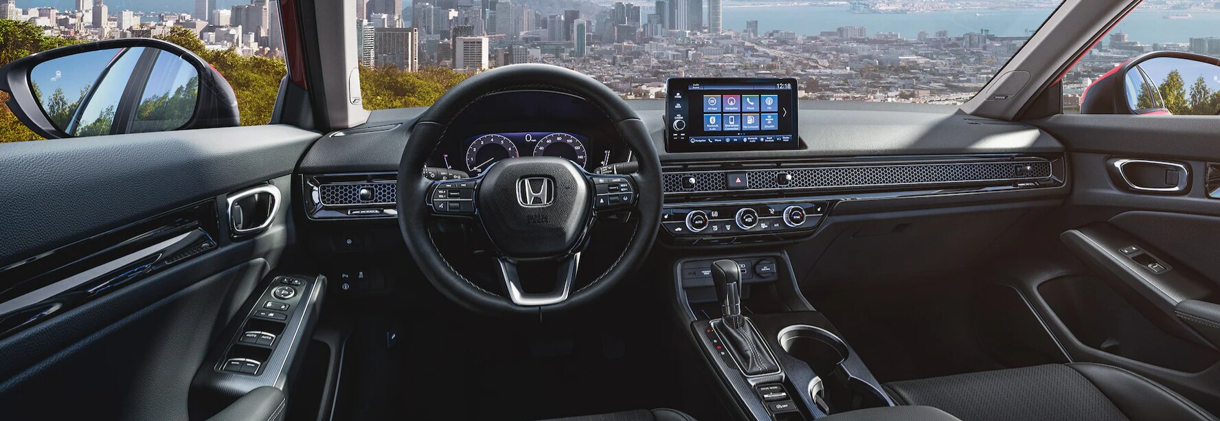 2022 Honda Civic Black Leather Front Seat Interior Dashboard and Infotainment 6.png A view of an all-black interior dash of a 2022 Honda Civic