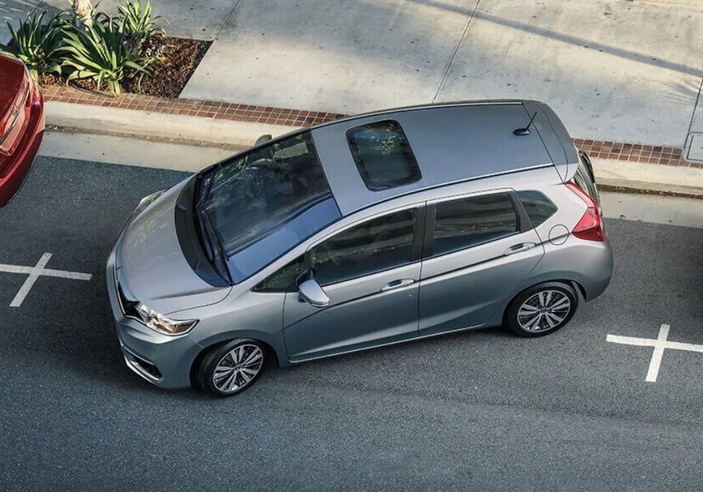 Aerial view of a 2020 Honda Fit leaving a parking spot giving a good look at the exterior dimensions