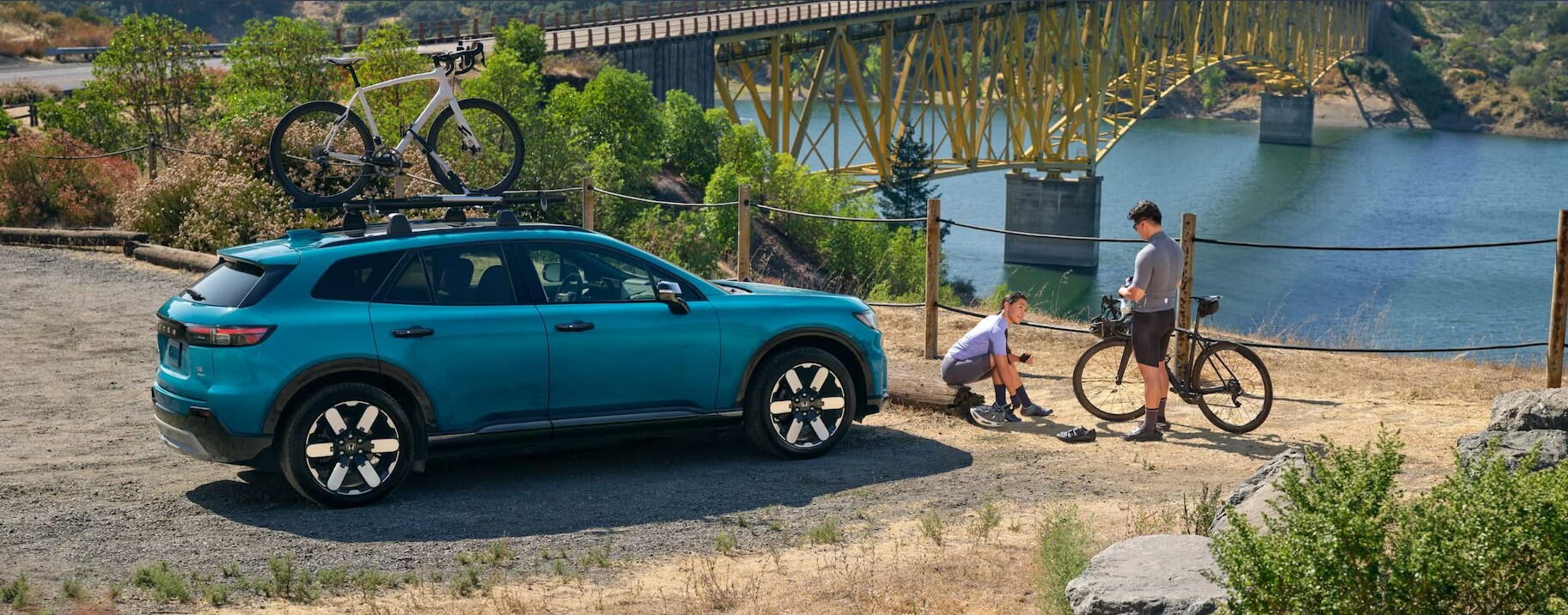 Screenshot%202025-03-18%20203819.png Blue Honda Prologue parked above a river.